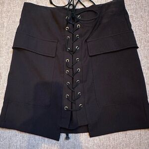 Promesa Elegant Black Skirt with lace up design. Lined size small great cond.